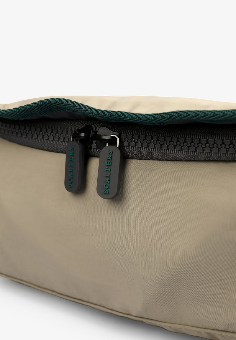 TOILETRY BAG WITH FLAP FASTENING
